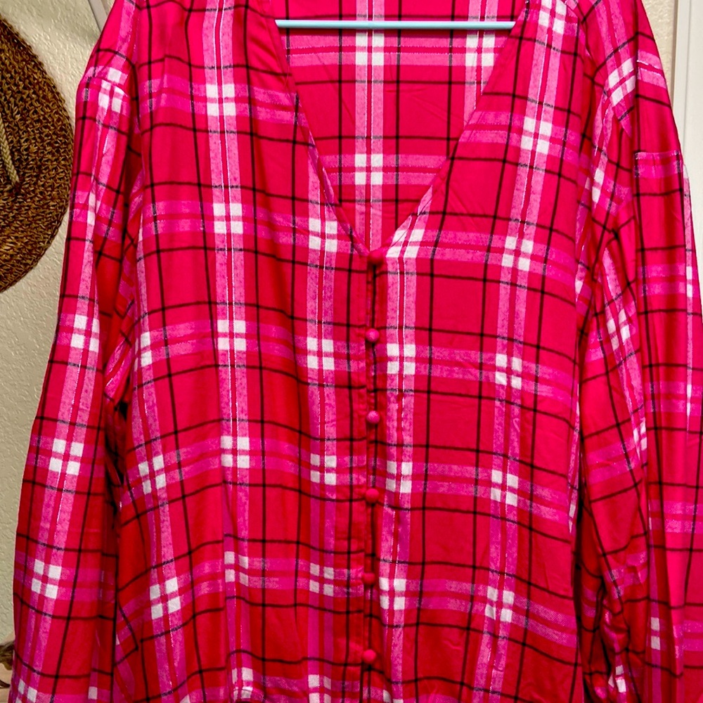 There’s a pink and white plaid tunic from Lane Bryant